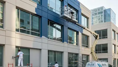 Professional commercial painters working on office exterior in Marietta, GA