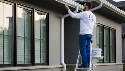 Professional gutter painting on a Marietta, GA home by expert house painters